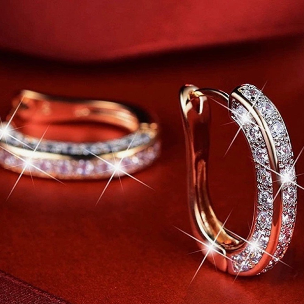 Swarovski Crystal and rose gold plated sterling silver huggie hoop earrings.